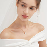 STMG Natural Pearl on Crescent Moon Necklace on neck