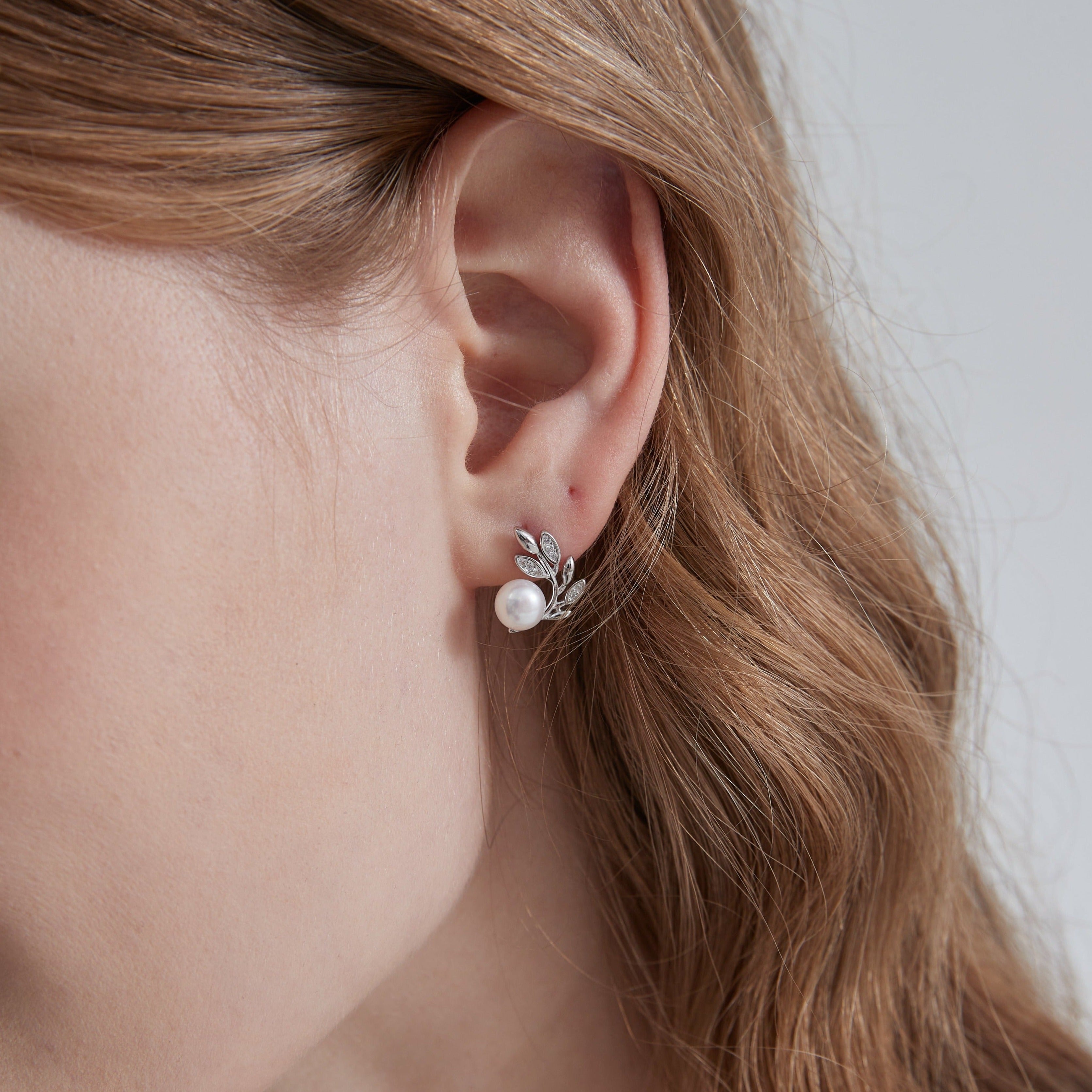 STMG Natural Pearl on Olive Leaf Stud Earrings in silver on ear