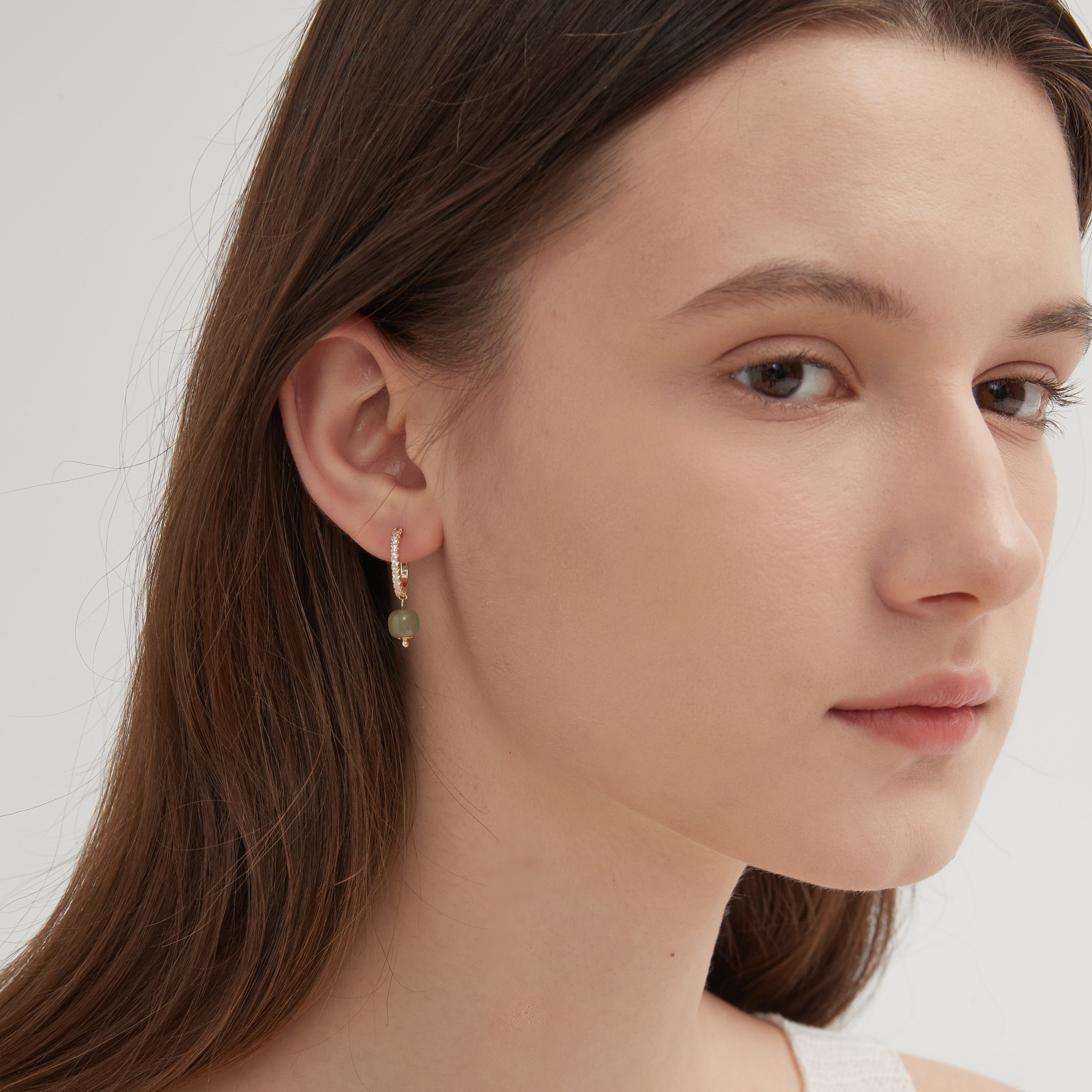 STMG Natural Jade Dangle Earrings on ear