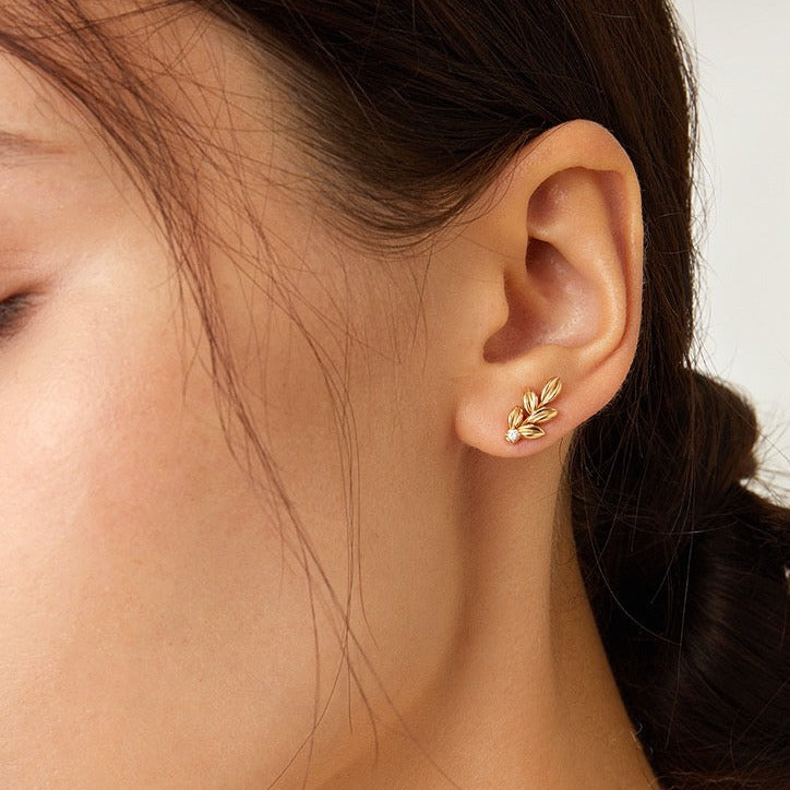 STMG Olive Leaf Stud Earrings in gold on ear