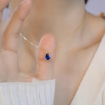 Blue Water Droplet Necklace on neck